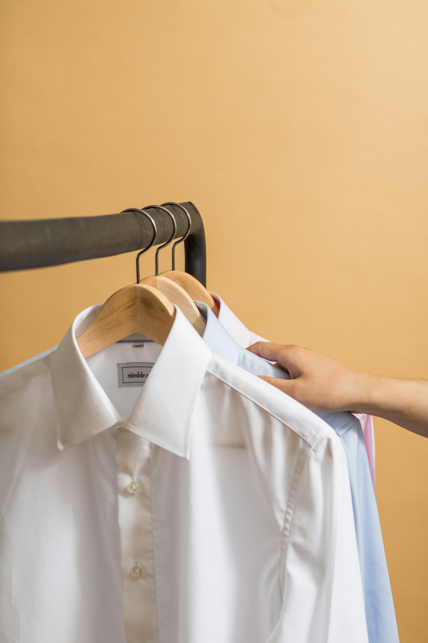 Pressed white shirts on hangers